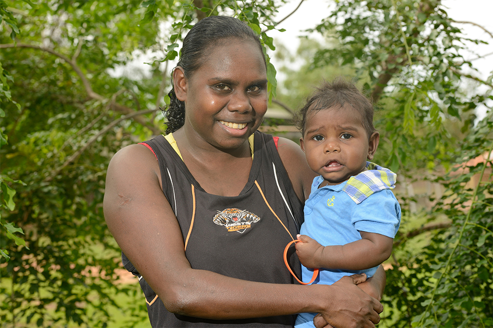 Indigenous woman holding child