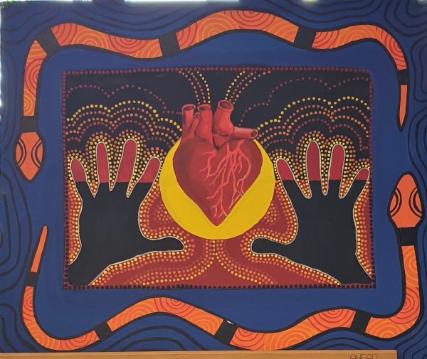 Title of Artwork - Aboriginal Heart: the centre of our people | “The heart in the centre of the Aboriginal flag represents life of our people. The hands identify Aboriginal children being surrounded by the strength of the snakes.”