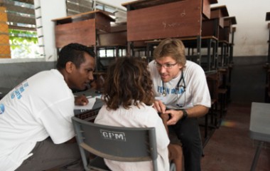 Josh and Anary treat Timor Leste child